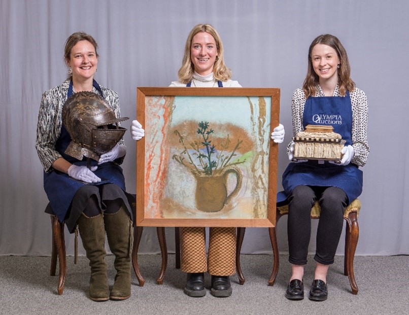 Image of three colleagues from Olympia Auctions holding objects